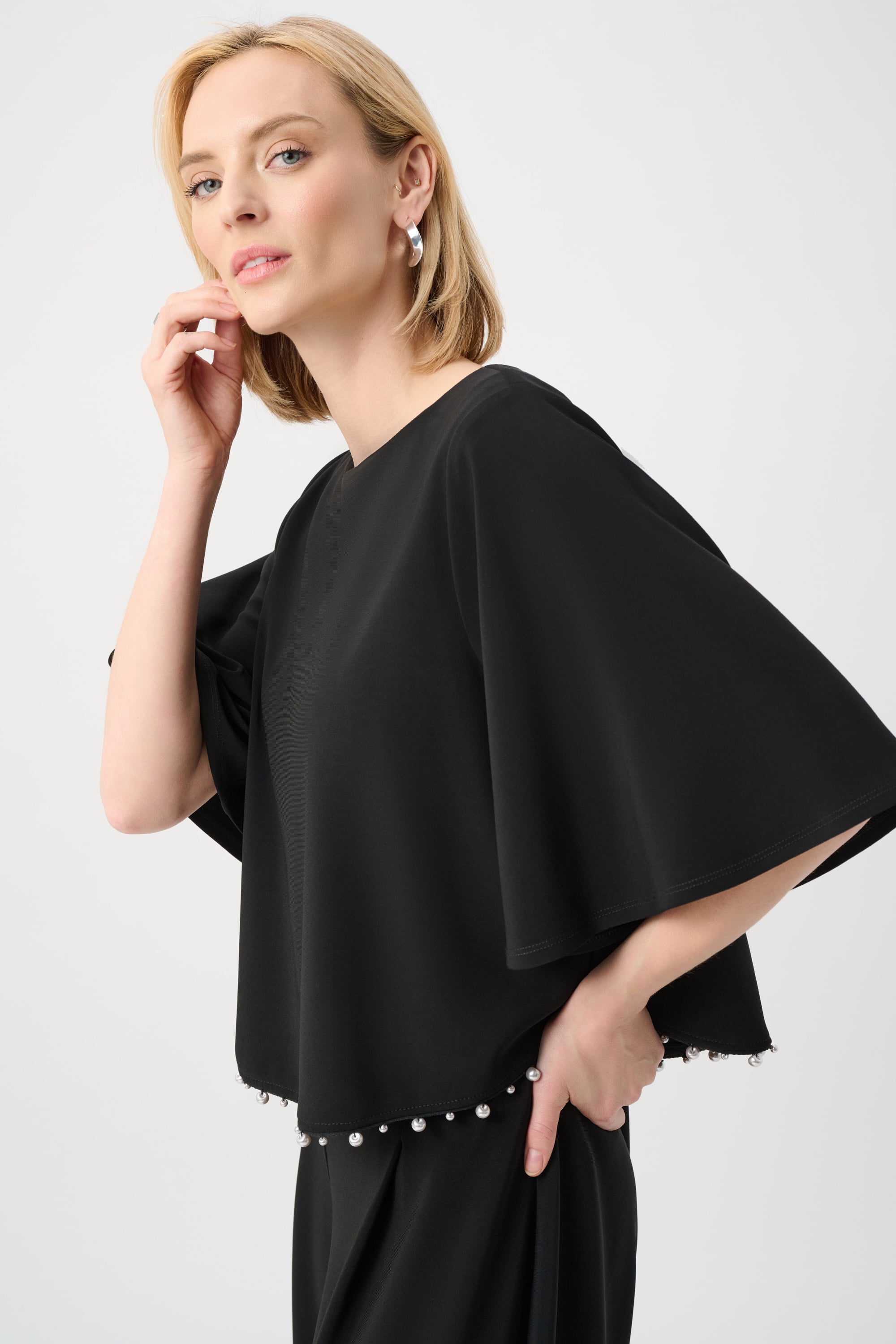 Silky Knit Flared Top With Pearl Detail