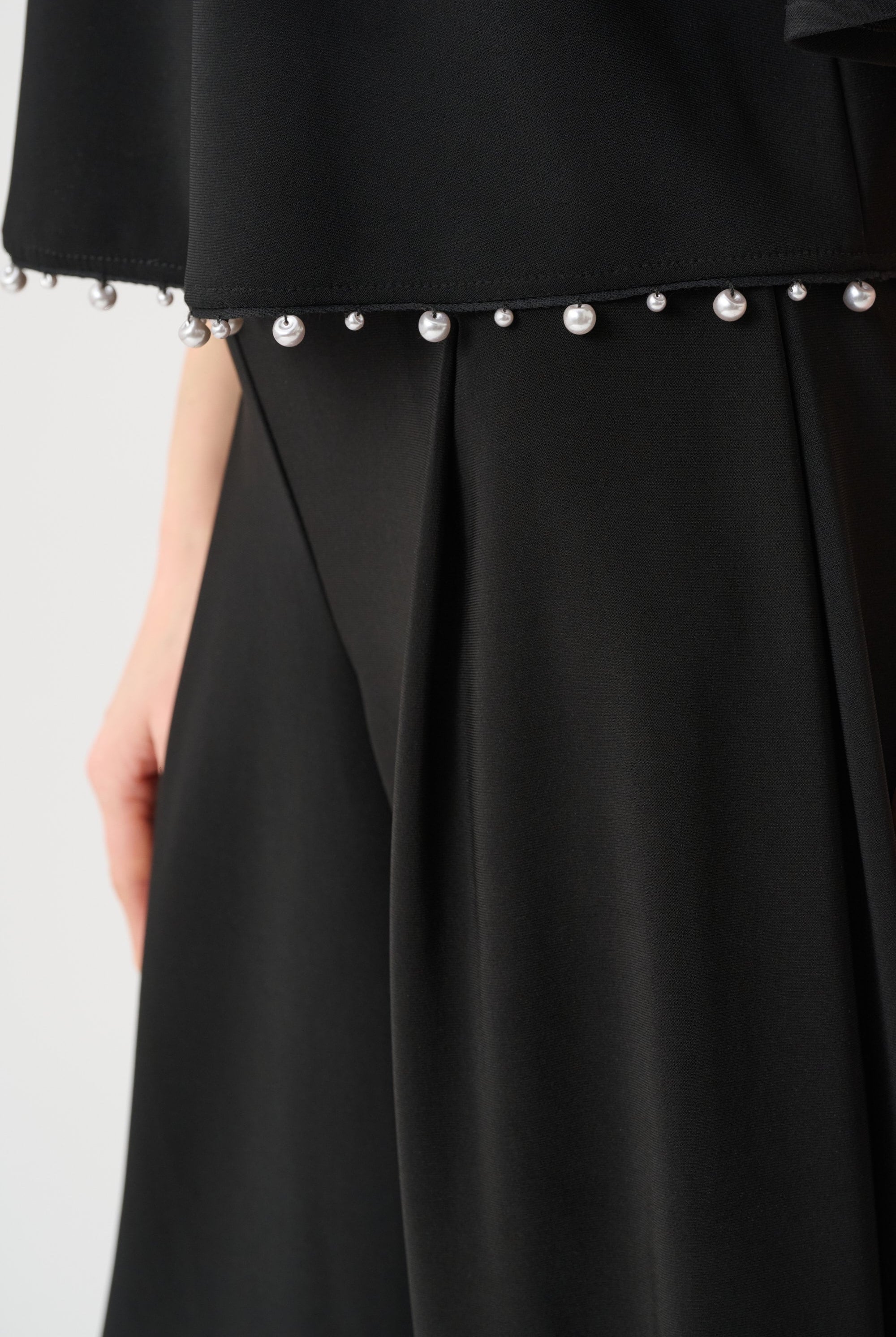 Silky Knit Flared Top With Pearl Detail