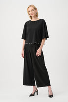 Silky Knit Flared Top With Pearl Detail